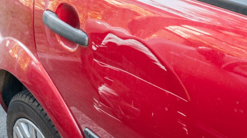 scratches on the side door of the red car collision or accident t20 kRnP7r